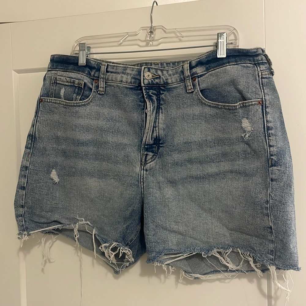 Old navy Jean shirt with full button front closure. Raw hem and some distressing